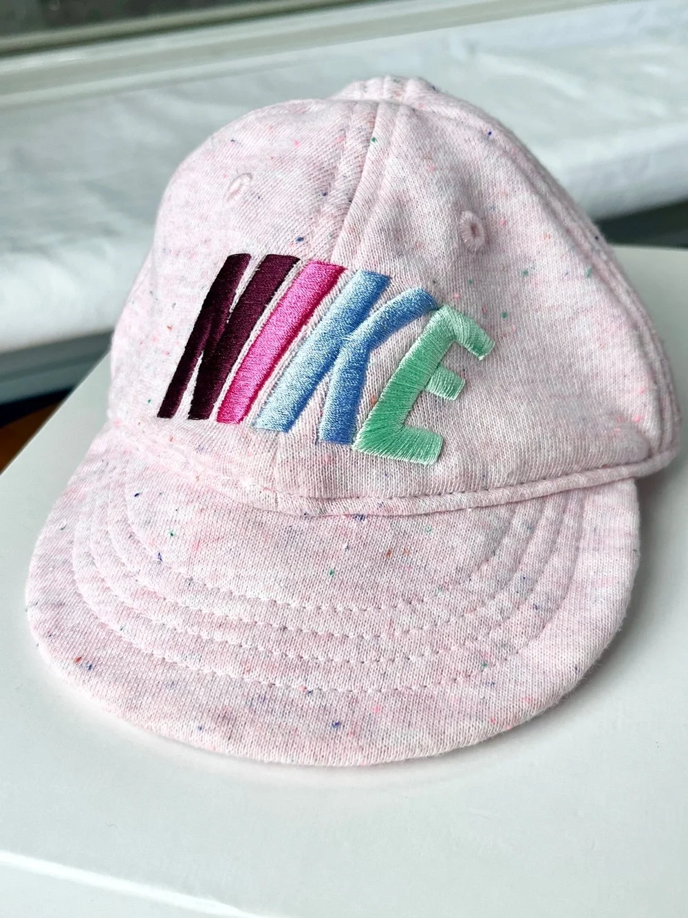 Nike Baby French Terry Knit Cotton Cap in “Speckled Pink Foam”